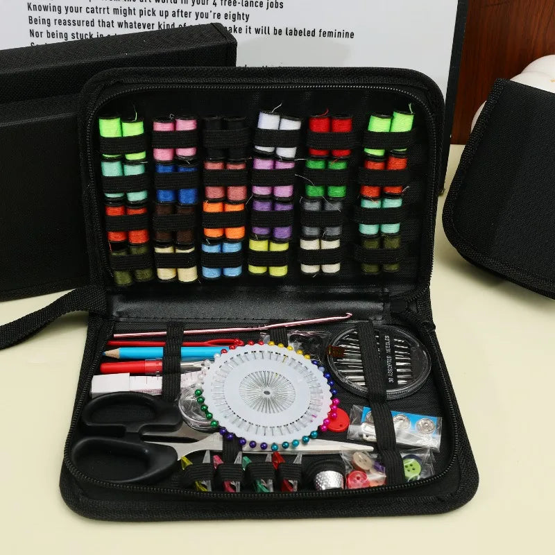 A black zippered pouch containing a multi-function sewing kit with various tools and needles.