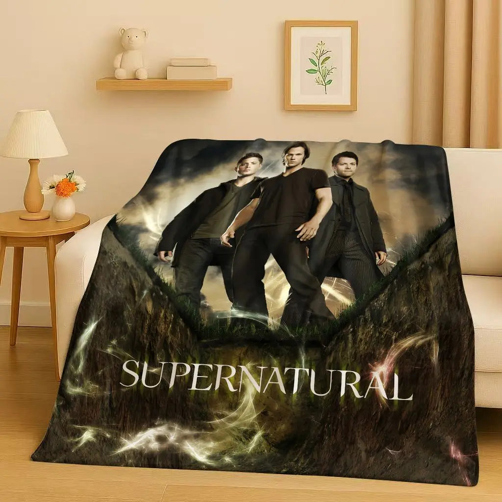 A dark, moody photograph featuring three men in dark clothing against a misty background, printed on a flannel throw blanket.