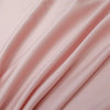 Soft pink luxury bamboo flat sheets draped and flowing