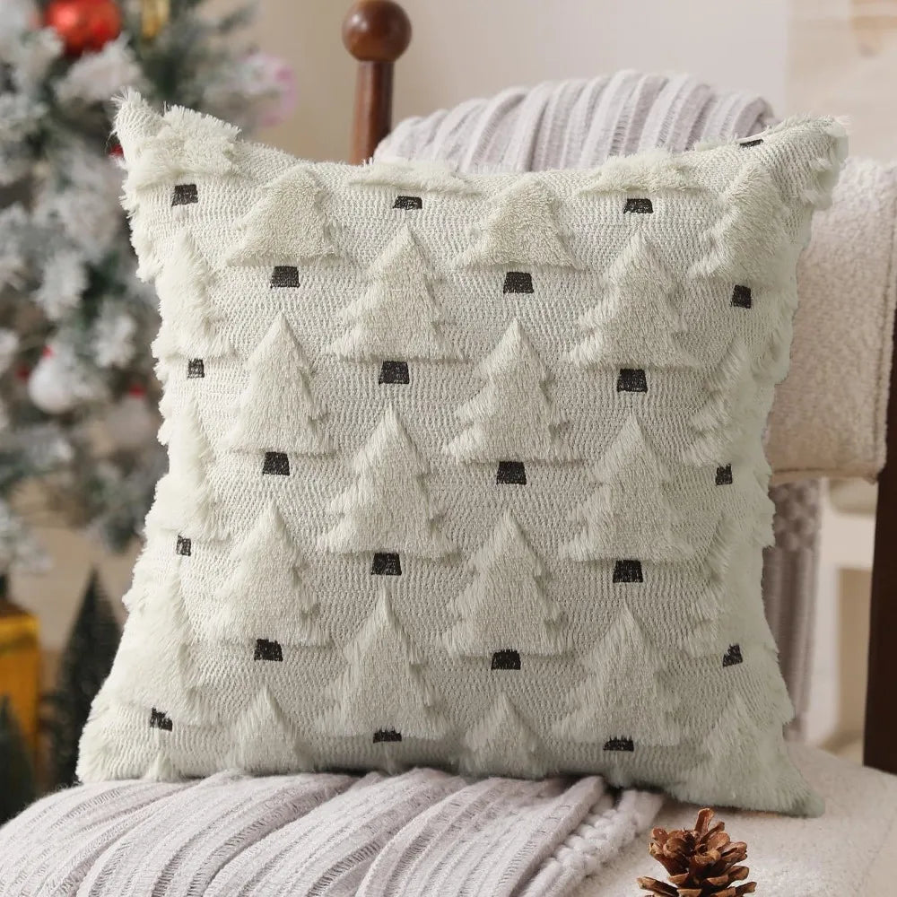A cream-colored knitted throw pillow with a textured pattern resembling stylized Christmas trees.