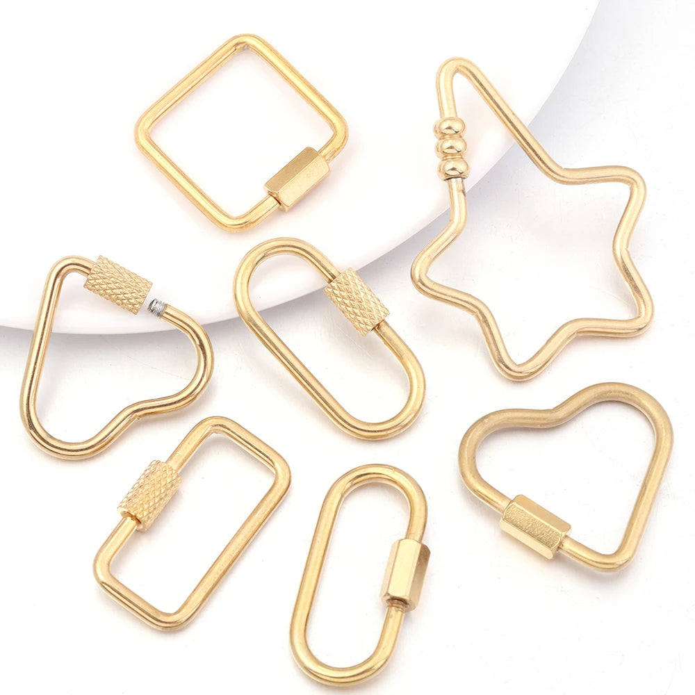 Several gold stainless steel heart-shaped screw lock carabiner clasps for jewelry making