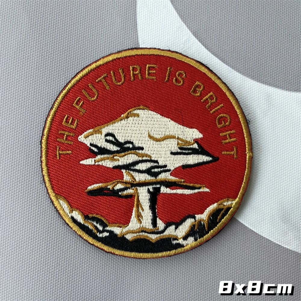 Red embroidered patch featuring a white mushroom cloud design with the text The Future Is Bright