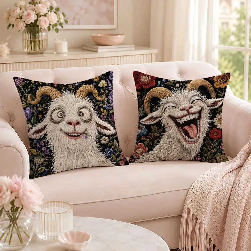 A pair of funny screaming goat pillow covers displayed on a light pink sofa.