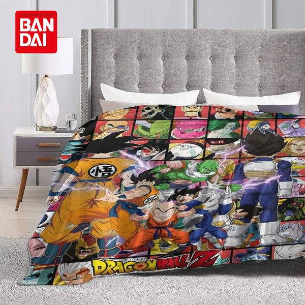 A colorful anime character flannel throw blanket displayed on a bed with a gray upholstered headboard.