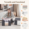 A set of foldable clothes and blanket storage bags with clear windows displayed on a light-colored rug.