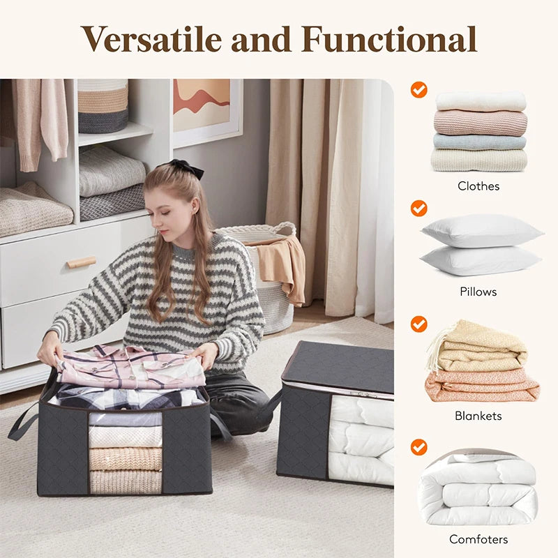 A set of foldable clothes and blanket storage bags with clear windows displayed on a light-colored rug.