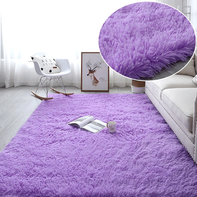 Purple fluffy area rug with a white chair and framed art in a bright room.
