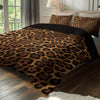A leopard print duvet cover set featuring brown and black spots displayed on a bed with neutral bedding.