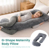 A woman is resting comfortably on a gray G-Shape Maternity Body Pillow on a bed.