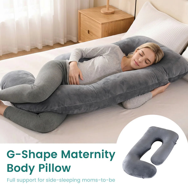A woman is resting comfortably on a gray G-Shape Maternity Body Pillow on a bed.