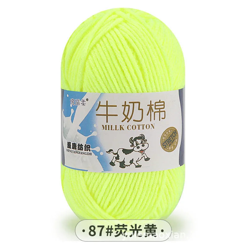 A ball of bright yellow milk cotton yarn for knitting.