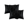 A set of black satin silk pillow covers for hair and beauty.