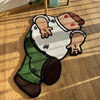 A funny cartoon rug depicting a person in a white shirt and green pants with a brown skin tone.