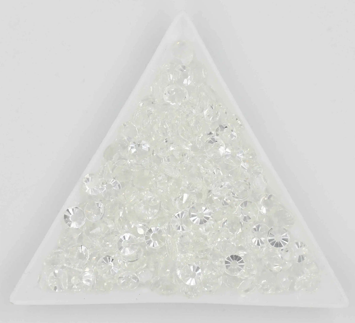 A triangular display of clear crystal AB flatback rhinestones for crafts and decor.