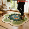 A round rug featuring a green and beige koi fish pattern placed on a wooden floor.