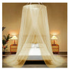 A sheer beige mosquito net canopy draped over a bed, providing a soft, flowing enclosure.