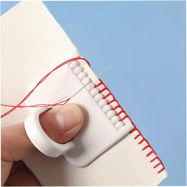 A hand is using a precision sewing guide template kit with a red thread to mark a seam on white fabric.