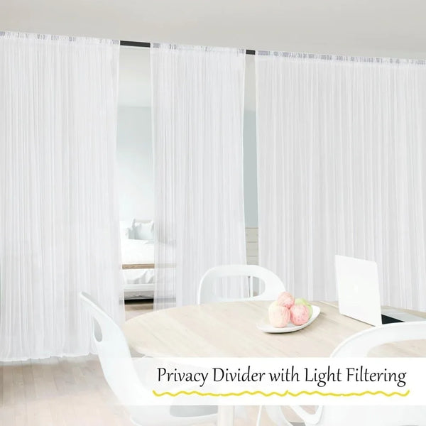 White privacy divider with light filtering fabric used to separate rooms.