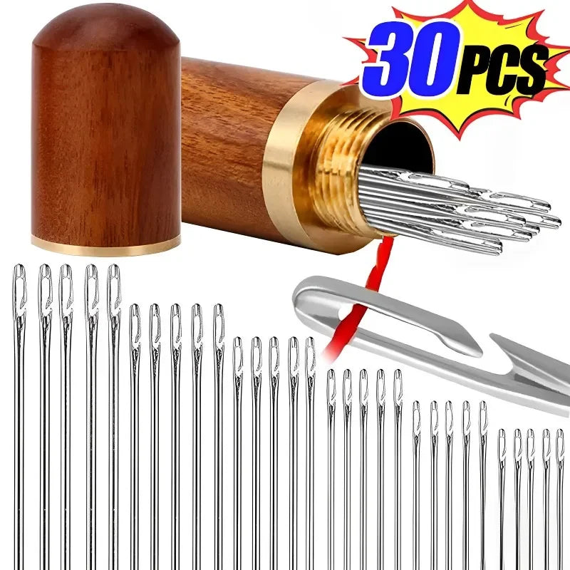 A set of stainless steel sewing needles is shown alongside a wooden bobbin and a silver needle holder.