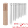A set of 30 stainless steel sewing needles in a natural color stored in a wooden box.
