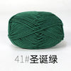 A ball of dark green organic cotton 4ply knitting yarn for crafts.
