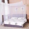 White mosquito net draped over a bed for bedroom protection