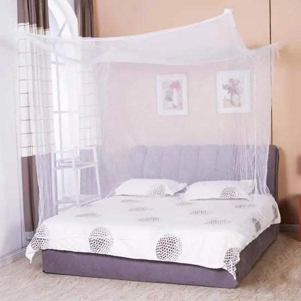 White mosquito net draped over a bed for bedroom protection