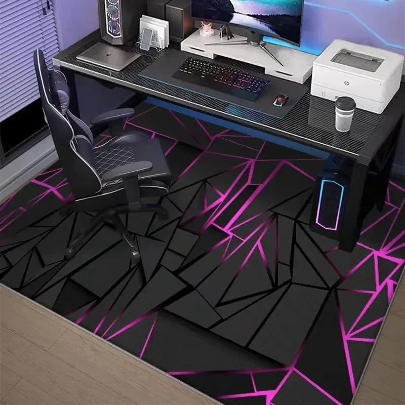 A black gaming desk setup featuring a neon hexagon area rug with pink and blue accents.