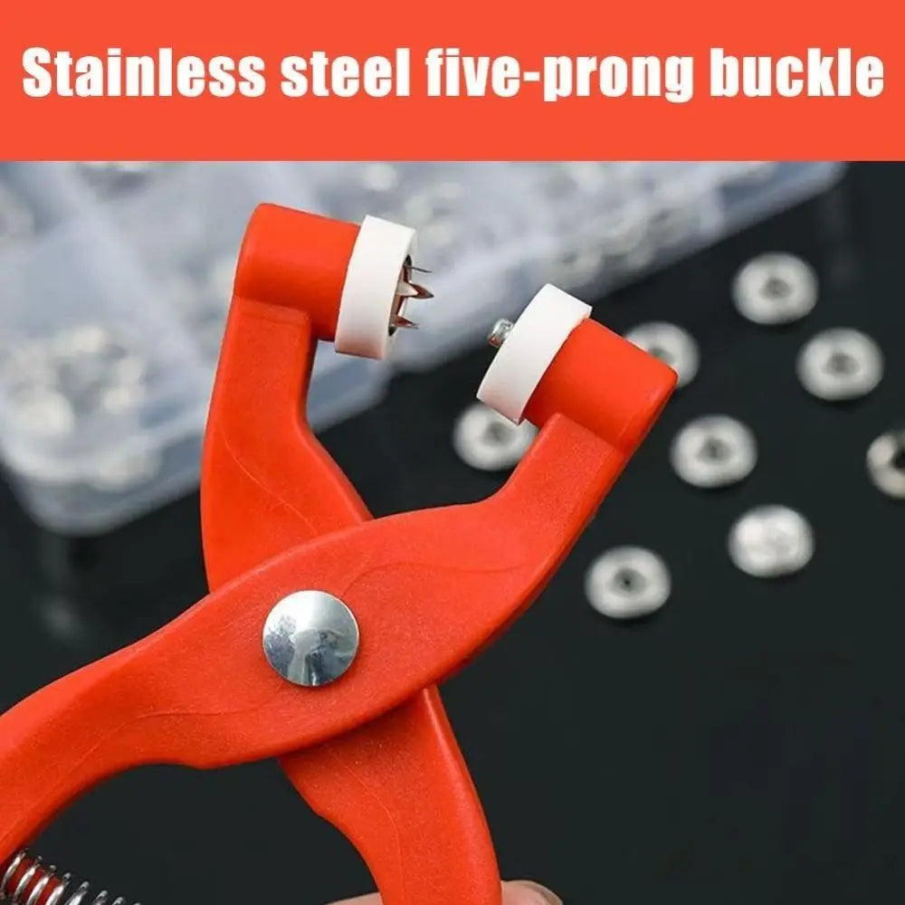 Close-up of an orange stainless steel five-prong buckle tool with a white handle and crimping hook.
