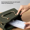 A hand sewing machine is shown being taken out of a dark green pouch for travel or storage.