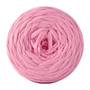Pink soft t-shirt yarn coiled into a round ball for crochet
