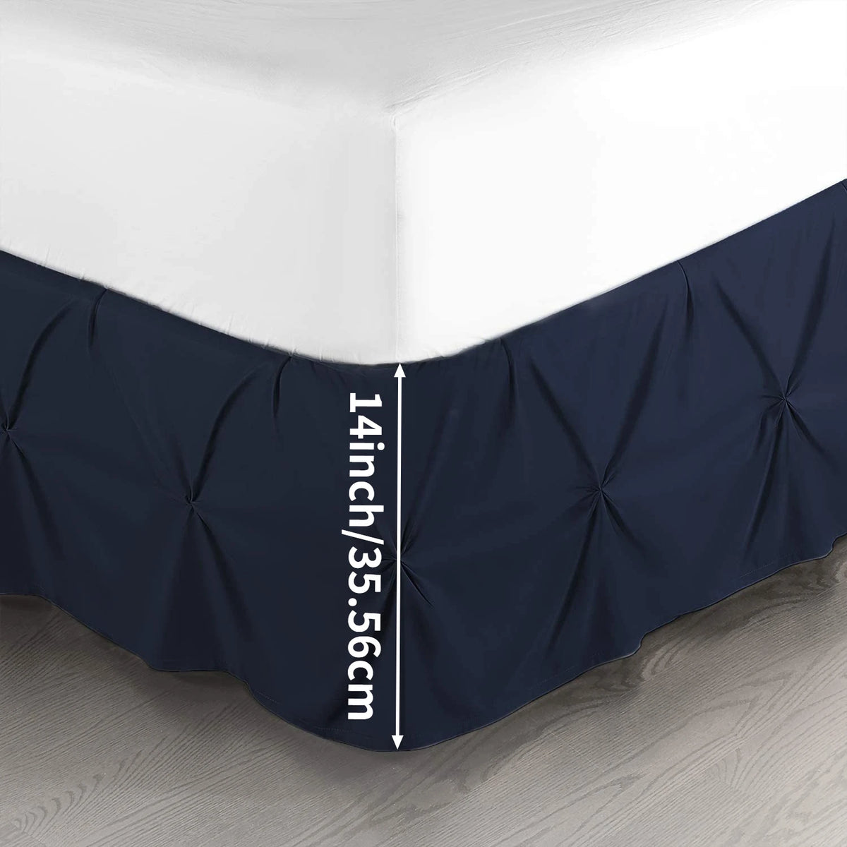 Navy blue premium wrap-around bed skirt shown against a white wall, displaying the 14 inch height measurement.