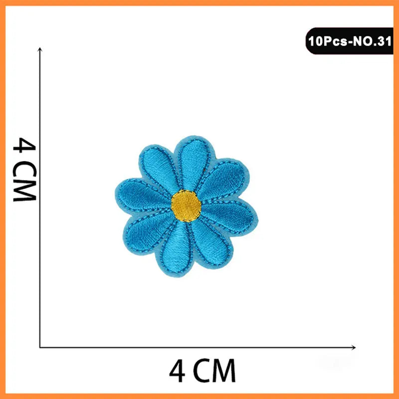A set of 10 embroidered iron-on patches featuring blue flowers and roses.