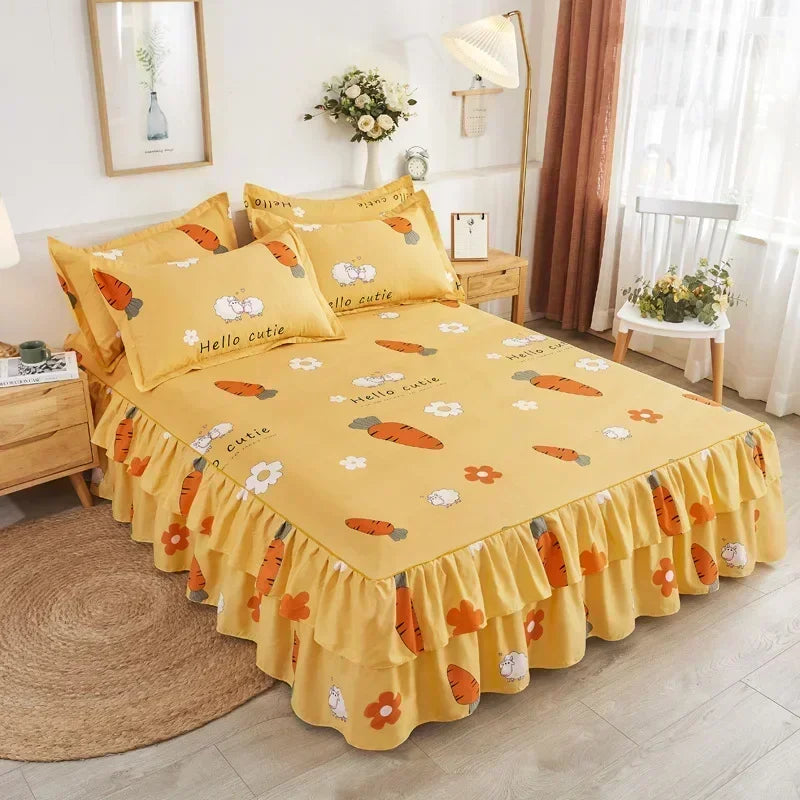 A yellow double layer printed bed skirt with orange carrot patterns on a bed.