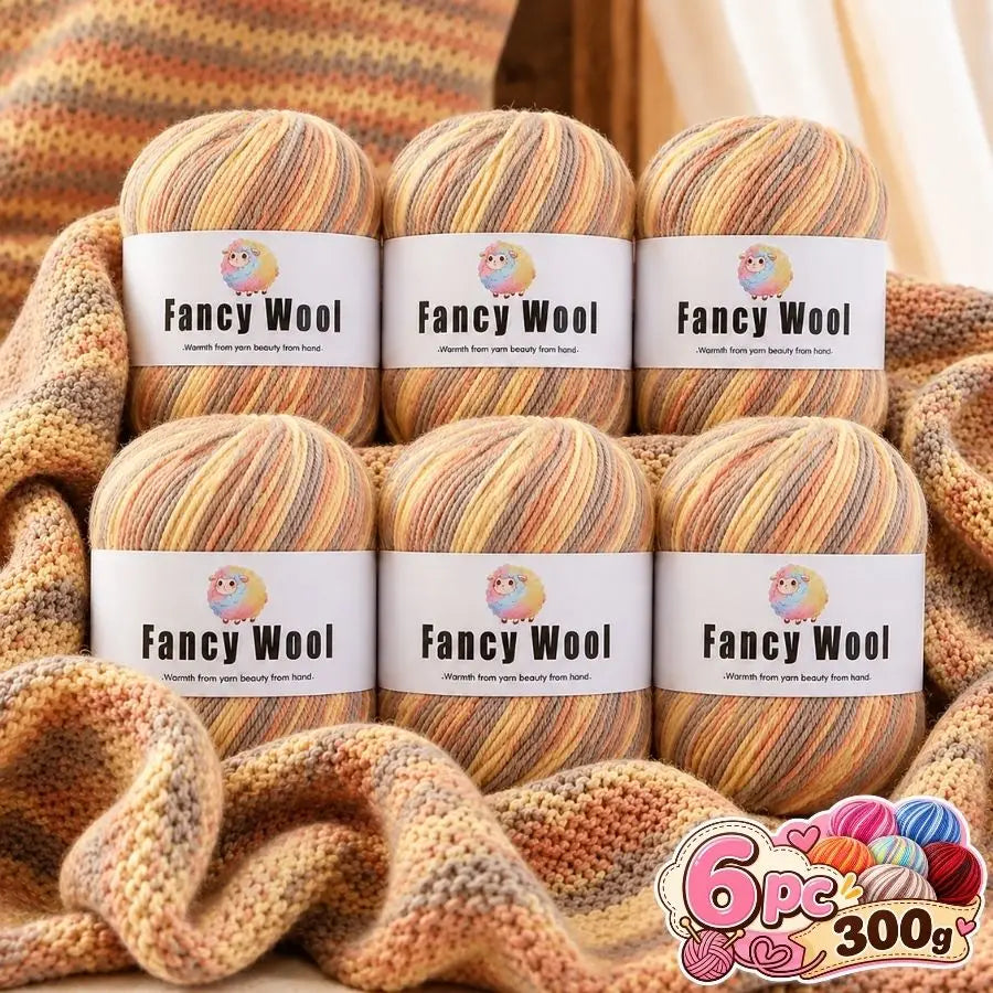 A set of six balls of gradient alpaca wool yarn in various shades and textures for knitting and crochet projects.