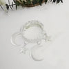A set of two silver-toned vintage curtain clips featuring a woven star and crescent moon design.