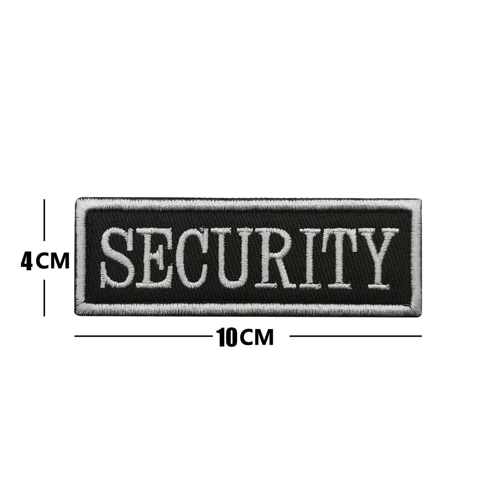 Black embroidered security patch with the word SECURITY on it, measuring 10cm long and 4cm high.