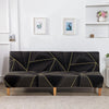 Black spandex slipcovers with a geometric gold print on a sofa bed.
