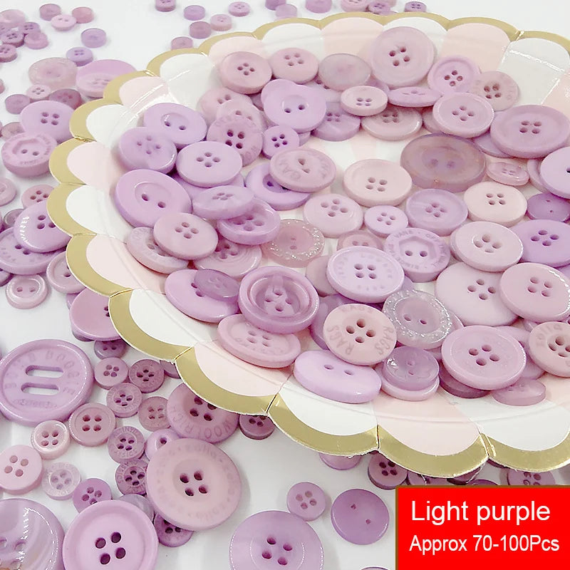 Assorted resin sewing buttons in light purple and pink shades arranged on a white plate.