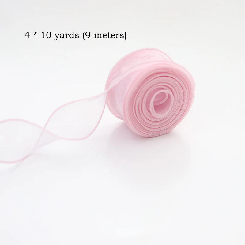Pink silky organza ribbon rolled for gift wrapping and crafts