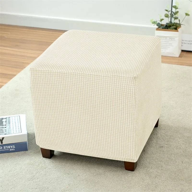 A beige folding tatami seat cover rectangular cushion placed on a light carpet.