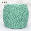 A ball of light mint green metallic silk yarn used for crocheting and knitting.