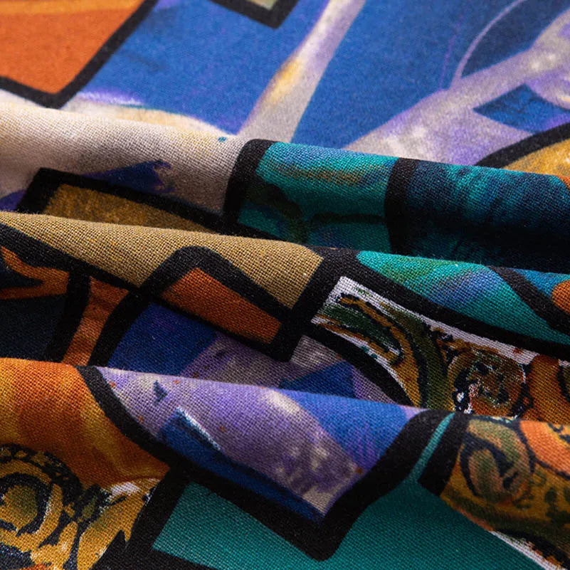 Close-up of bohemian printed linen fabric showing various colors and patterns folded together.