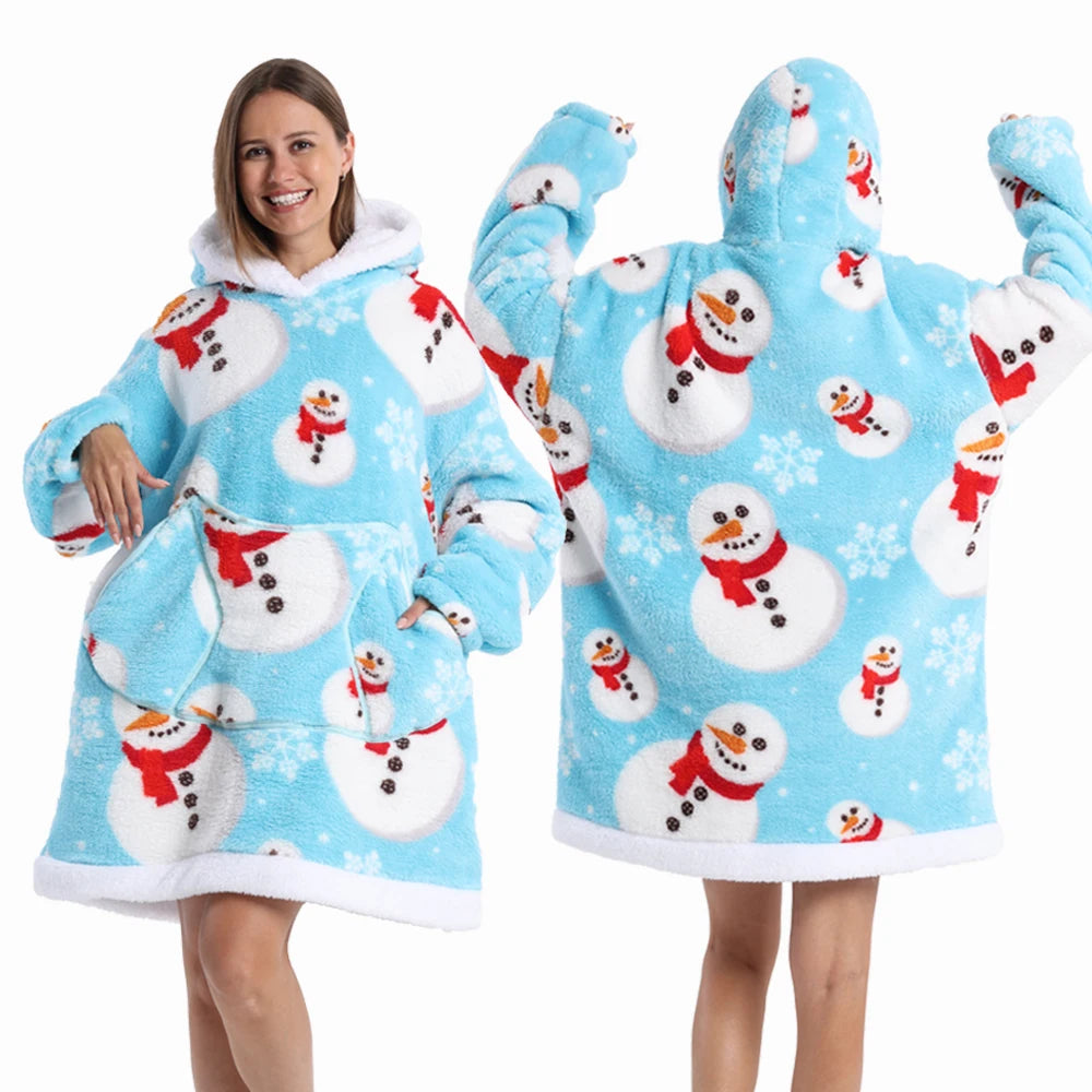 A woman models a light blue patchwork fleece hoodie with white and red snowman patterns.