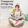 A boy is sitting inside a large, transparent storage bag filled with plush toys.