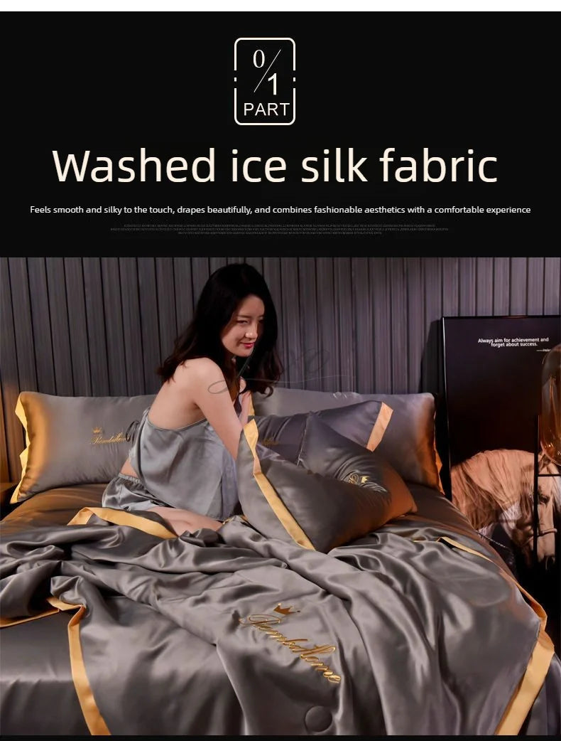 A model is relaxing on a bed covered with a luxurious gray ice silk fabric blanket and pillows.
