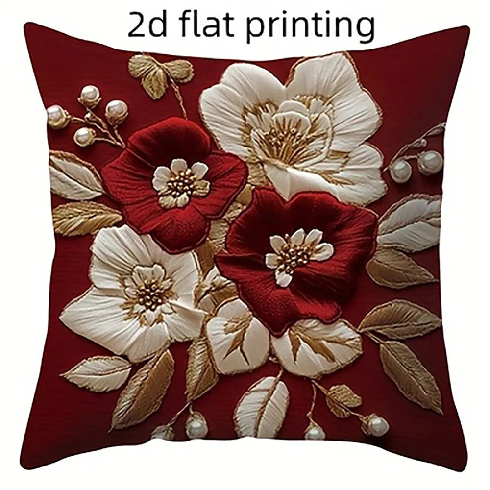 A deep red pillow cover featuring white and gold floral embroidery in a 2D flat print style.