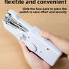 A hand is sliding a fuse back into a portable mini hand sewing machine to press the switch.
