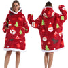 A woman models a red patchwork fleece hoodie with white trim and festive Christmas patterns.