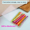 A clear plastic container filled with 50 multicolored plastic sewing needles for yarn crafting.